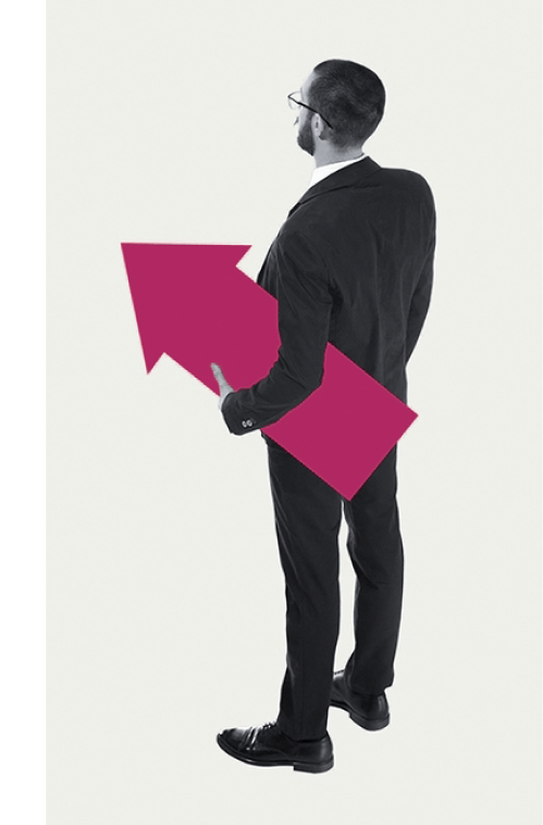 An investor standing and pondering