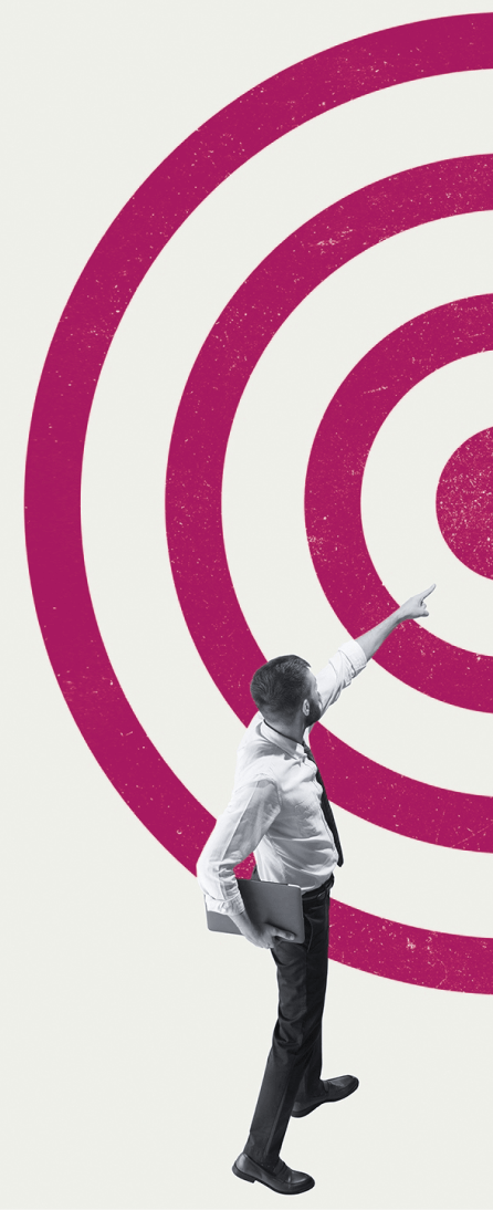 A man pointing at a concentric-circle-target center